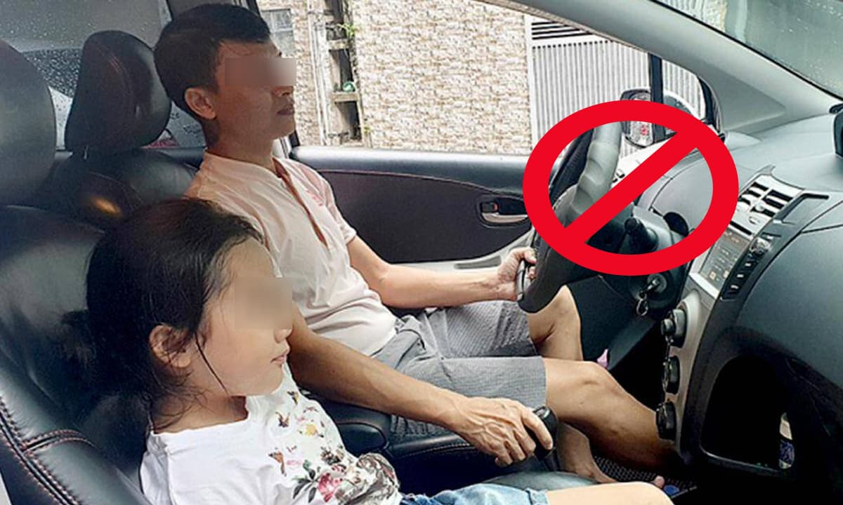 tre nho ngoi ghe truoc gay mat tap trung cho nguoi lai Trẻ nhỏ ngồi ghế trước gây mất tập trung cho người lái